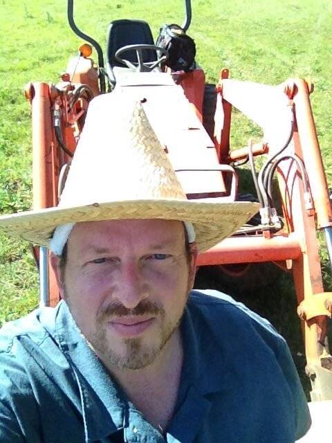 The Fat Rancher Photo of tractor operator