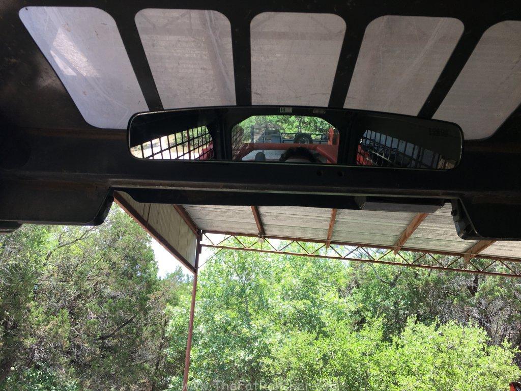 Photo of mirror installed in track loader.