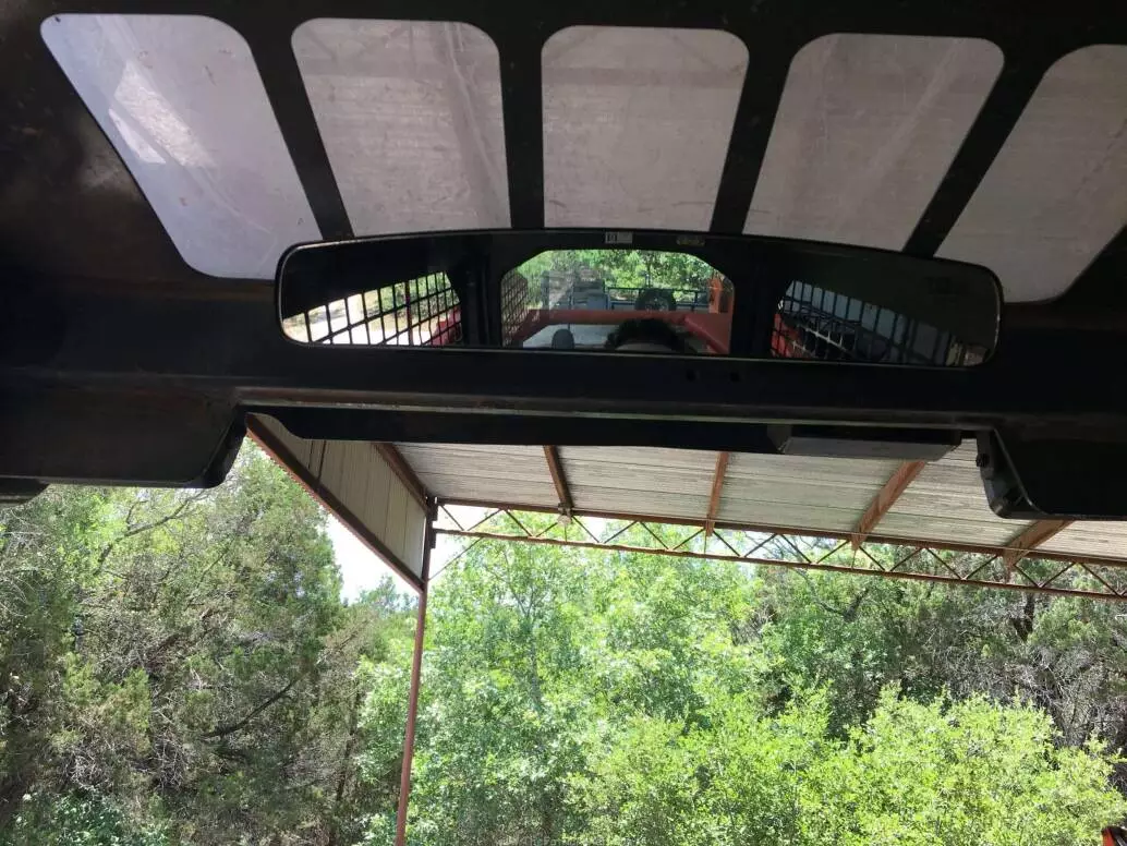 Photo of mirror installed in track loader.
