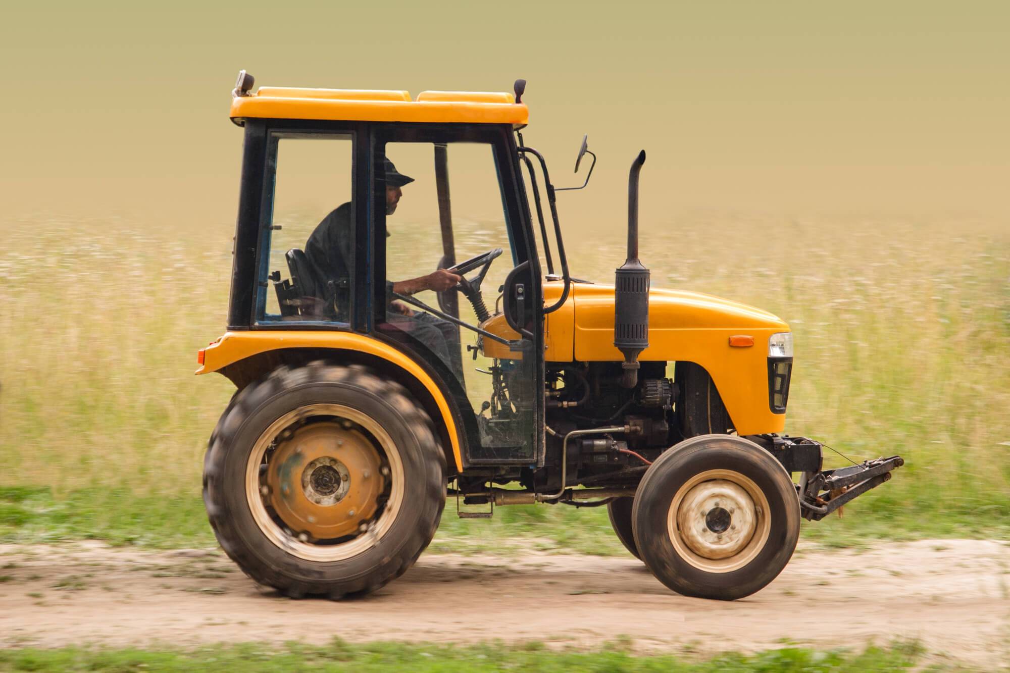 Farm tractor Farmer in tractor