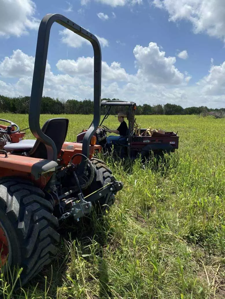 Tractor and UTV in field