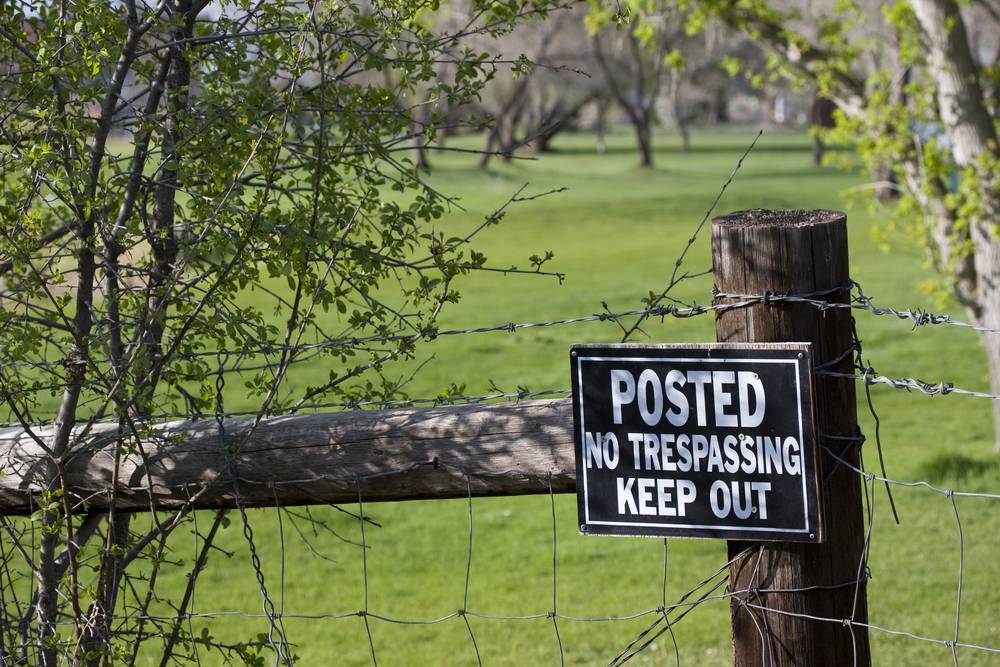No Trespassing Sign Fence post with trespassing sign