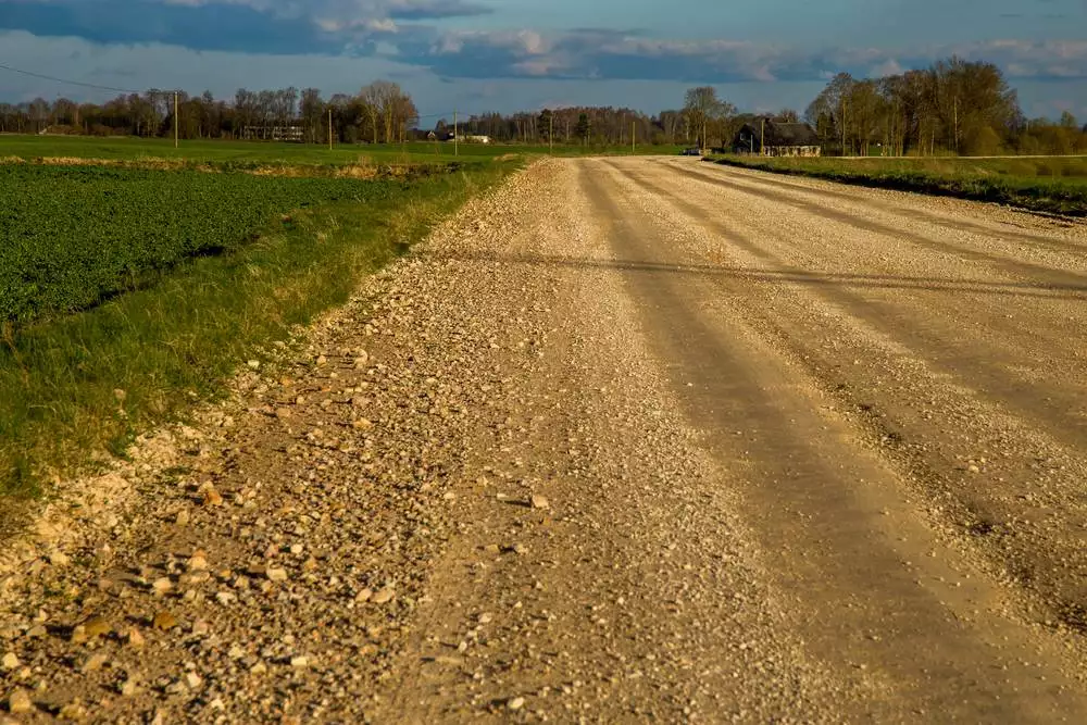 Typical packed road base county road to travel to homestead property.
